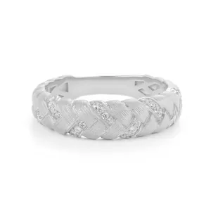 Silver woven wheat ear ring with sparkling zircon inlays in a minimalist vintage style
