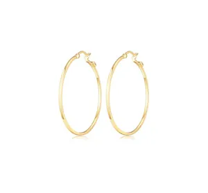 Detailed view of large gold hoop earrings with a polished finish and secure clasp