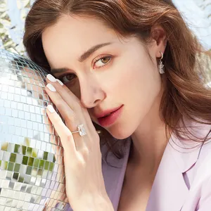 Luxury emerald-cut cubic zirconia ring and earrings set with shimmering diamond accents