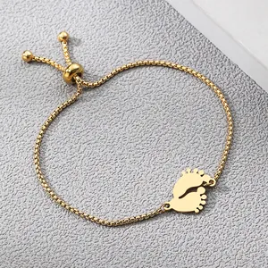 Minimalist gold baby feet pendant bracelet with adjustable box chain and slider clasp