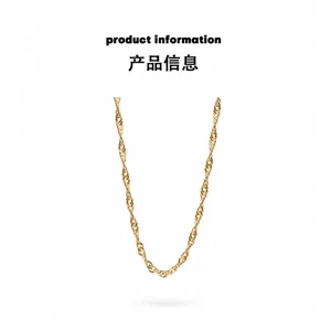 Macro detail of golden twist chain necklace with shimmering metallic texture and links