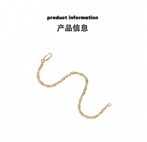 Close-up of gold rope chain bracelet with a classic metal lobster clasp and ring closure