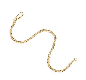 Detailed close-up of a golden water-ripple twisted chain bracelet with a secure lobster clasp