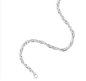 Macro view of a silver twisted wave chain bracelet with a round spring clasp