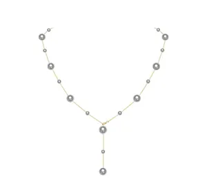 Close-up of a gold Y-shaped necklace featuring elegant grey pearls on a white background