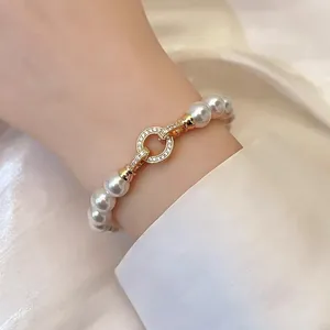 Elegant French vintage white round pearl bracelet with a sparkling gold zircon clasp