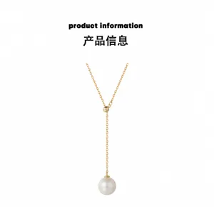 Detail of adjustable Y-shaped gold necklace with a white lustrous pearl pendant