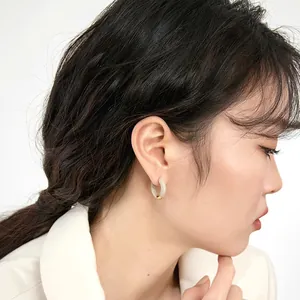 French vintage enamel hoop earrings with a gold bead accent and ivory jade texture