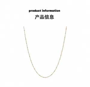 Close-up of 18K gold plated titanium steel bead chain necklace with polished finish