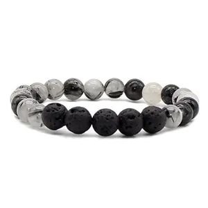 Elastic beaded bracelet featuring natural black lava stone and rutilated quartz beads