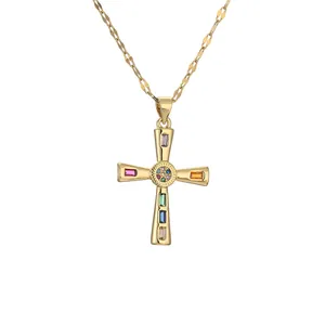 Gold cross necklace featuring rainbow baguette gemstones and micro-pave crystals