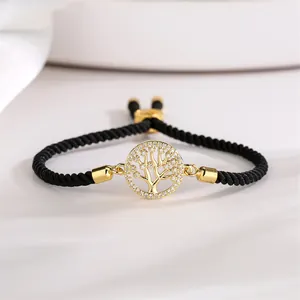 Macro detail of adjustable tree of life bracelet with gold plating and cubic zirconia
