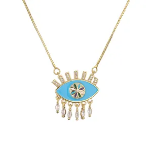 Χρυσό κολιέ Evil Eye με μπλε σμάλτο, βλεφαρίδες ζιργκόν και κρυστάλλινα μενταγιόν