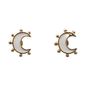 Minimalist gold plated crescent moon earrings with white enamel and bead details