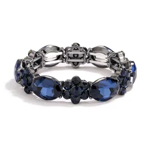 Vintage elastic bracelet with sapphire blue crystals and gunmetal finish on white background