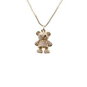 Collier pendentif ours doré avec zircons blancs et yeux noirs sur chaîne en or