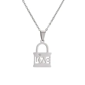 Polished stainless steel couple's necklace featuring a love heart puzzle lock pendant