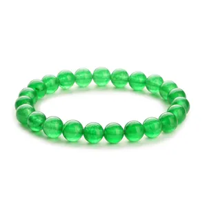 Green natural stone beaded bracelet featuring polished round jadeite or agate beads