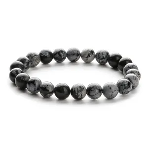 Natural snowflake obsidian beaded bracelet featuring smooth round stones on white background