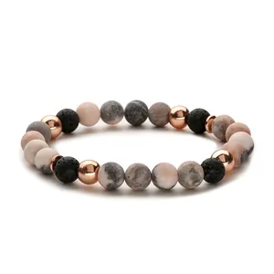 Natursteinarmband mit rosa Zebra-Steinen, schwarzen Lavaperlen und Roségold
