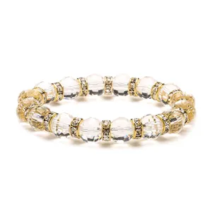 Faceted crystal glass bead bracelet in clear and golden tones with sparkling spacers