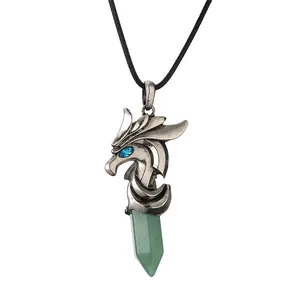 Vintage silver dragon head necklace with green hexagonal crystal pillar pendant on white backdrop