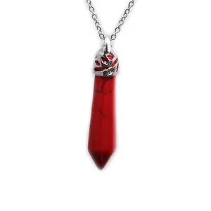 Hexagonal red turquoise pendant necklace with silver floral cap on a white background