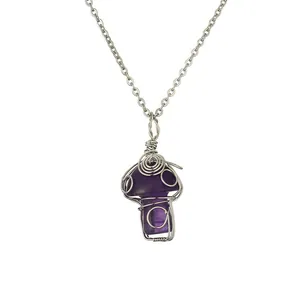 Handmade wire wrapped purple crystal mushroom pendant on a delicate silver chain necklace