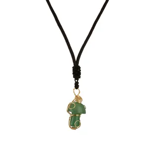 Handmade wire wrapped necklace with green crystal mushroom pendant and black woven cord