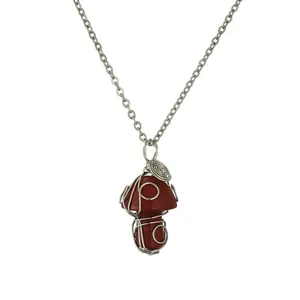 Handmade red jasper mushroom pendant necklace wrapped in silver wire on a chain
