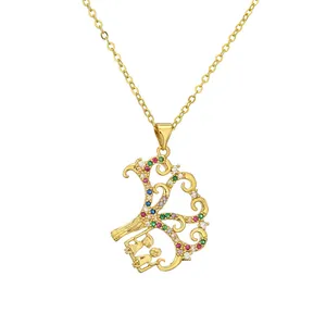 Collier arbre de vie doré avec cristaux colorés et pendentif figurines de balançoire