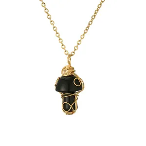 Handmade wire-wrapped mushroom pendant necklace with black agate stone in gold finish