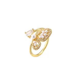 Bague papillon dorée élégante avec perles et cristal en forme de goutte d'eau