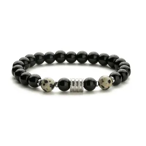 Pulsera de cuentas de obsidiana negra y jaspe dálmata con cuenta de metal plateado texturizado