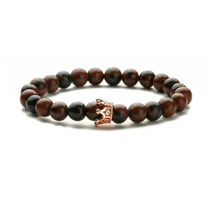 Mahogany obsidian beaded bracelet with a rose gold crown charm and white zircon inlay