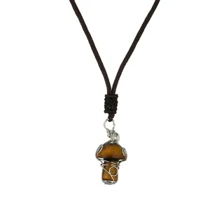Handmade wire wrapped tiger eye crystal mushroom pendant with brown woven necklace cord