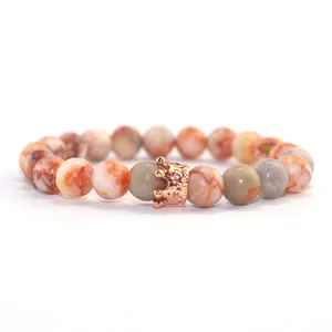 Agate bead bracelet with rose gold micro-set crown charm on white background