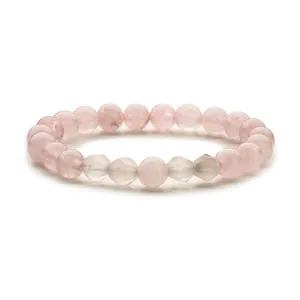 Elastisches Armband mit rosa Quarzperlen und fünf facettierten Kristallsteinen im Zentrum
