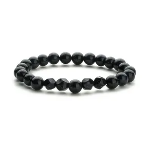 Elastisches Perlenarmband mit facettierten Goldfluss-Perlen und funkelndem Sterneffekt