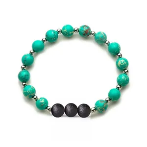 Turquoise bead elastic bracelet with silver spacers and black lava stone accents