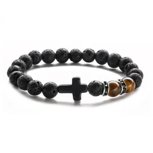 Black lava stone beaded bracelet with tiger eye beads and a cross pendant charm