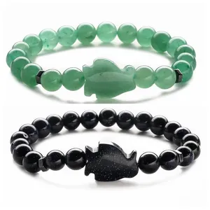 Bracciali in aventurina verde e pietra arenaria blu con teste di lupo intagliate