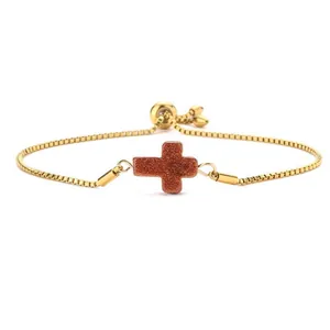 Adjustable gold box chain bracelet with a sparkling reddish-brown cross pendant charm