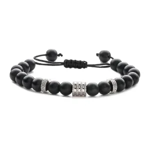 Adjustable matte black beaded bracelet with textured silver-tone metal spacers and cord