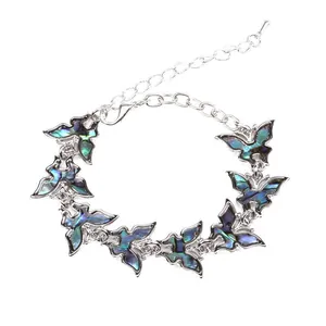 Silver butterfly bracelet with iridescent abalone shell inlays and lobster clasp