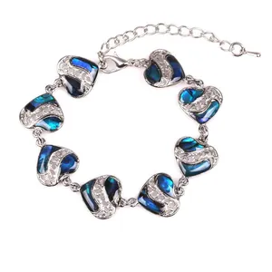 Silver-tone heart bracelet featuring vibrant blue abalone shell inlays and lobster clasp