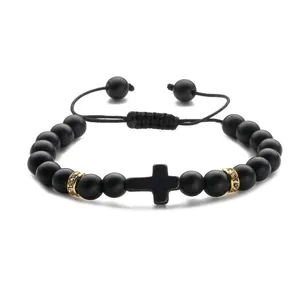 Matte black natural stone bead bracelet with cross pendant and golden rhinestone spacers