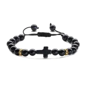 Blue sandstone cross beaded bracelet with black woven cord and golden crystal accents