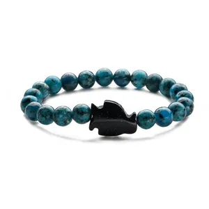 Blue phoenix stone beaded bracelet with a sparkling blue goldstone penguin charm