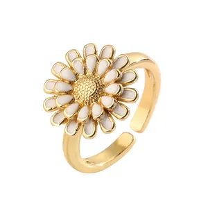 Elegant gold daisy flower ring with white enamel petals and adjustable open band design